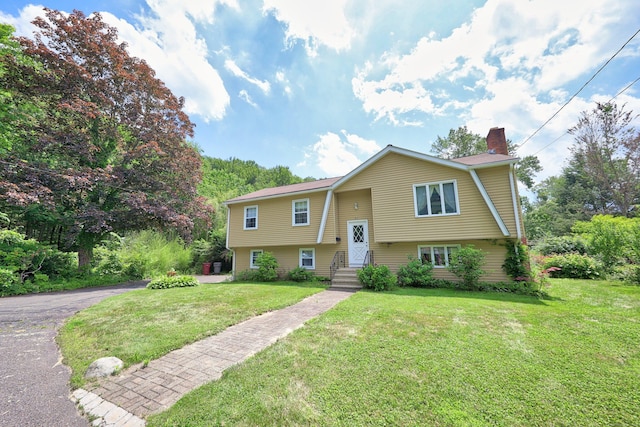 95 Hickory Rd, Naugatuck, CT 06770 - split foyer home featuring a chimney and a front yard