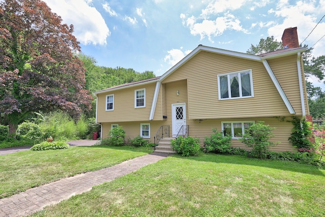 95 Hickory Rd, Naugatuck, CT 06770 - bi-level home with a chimney and a front lawn