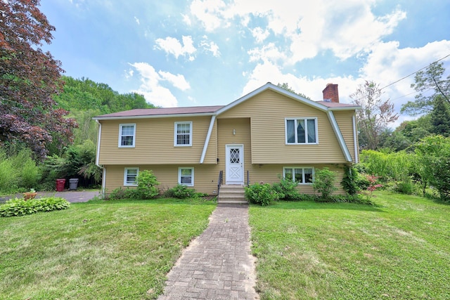 95 Hickory Rd, Naugatuck, CT 06770 - split foyer home with a chimney and a front lawn