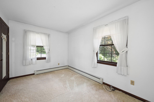 95 Hickory Rd, Naugatuck, CT 06770 - carpeted spare room featuring a baseboard heating unit