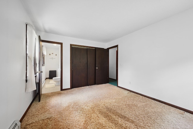 95 Hickory Rd, Naugatuck, CT 06770 - unfurnished bedroom with a baseboard heating unit, carpet, connected bathroom, and a closet
