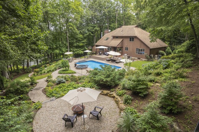 19 Pumpkin Hill Rd, Trumbull, CT 06611 - swimming pool featuring an outdoor fire pit, a patio, and view of wooded area