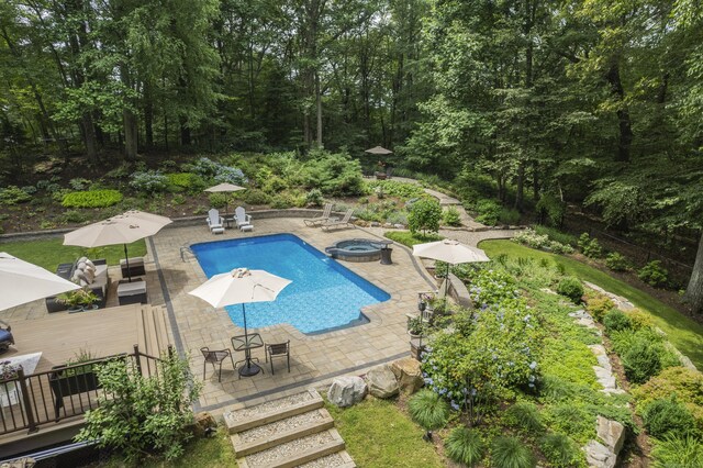 19 Pumpkin Hill Rd, Trumbull, CT 06611 - view of swimming pool with a patio area, outdoor dining space, and a pool with connected hot tub