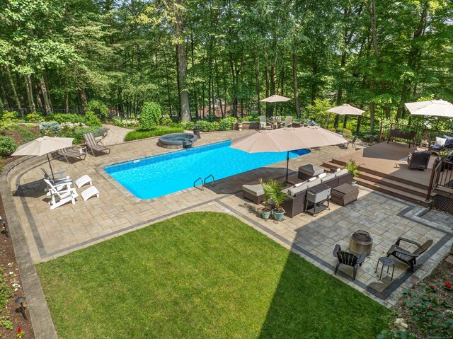 19 Pumpkin Hill Rd, Trumbull, CT 06611 - view of swimming pool with a wooden deck, an in-ground hot tub, a patio, and a fire pit