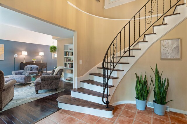 19 Pumpkin Hill Rd, Trumbull, CT 06611 - staircase with baseboards and a high ceiling