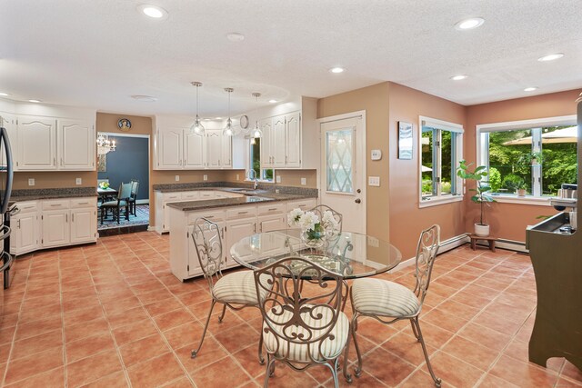 19 Pumpkin Hill Rd, Trumbull, CT 06611 - kitchen with white cabinetry, recessed lighting, light tile patterned floors, hanging light fixtures, and a textured ceiling