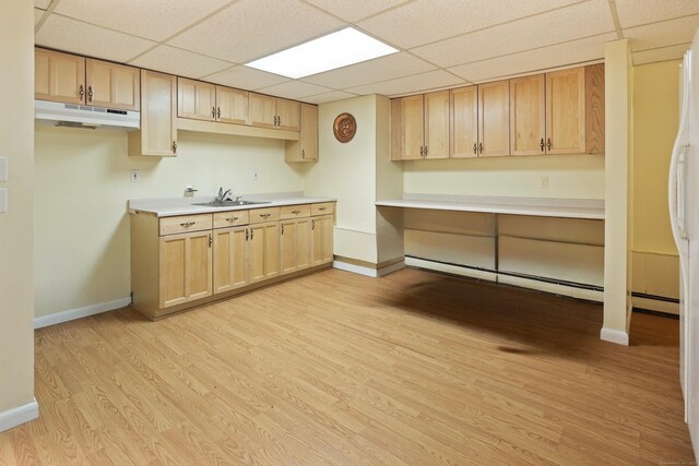 19 Pumpkin Hill Rd, Trumbull, CT 06611 - kitchen featuring under cabinet range hood, a paneled ceiling, light wood-style floors, light brown cabinets, and light countertops
