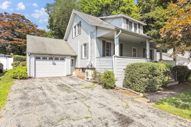 12 Lincoln Ave, Danbury, CT 06810 - view of front of property with driveway, covered porch, roof with shingles, and an attached garage