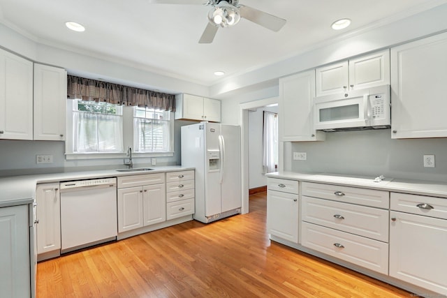 12 Lincoln Ave, Danbury, CT 06810 - kitchen featuring white appliances, white cabinets, a ceiling fan, light countertops, and crown molding