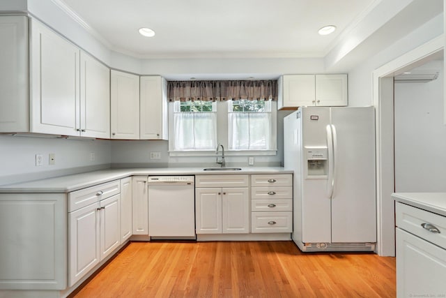 12 Lincoln Ave, Danbury, CT 06810 - kitchen featuring white appliances, white cabinetry, light countertops, crown molding, and recessed lighting