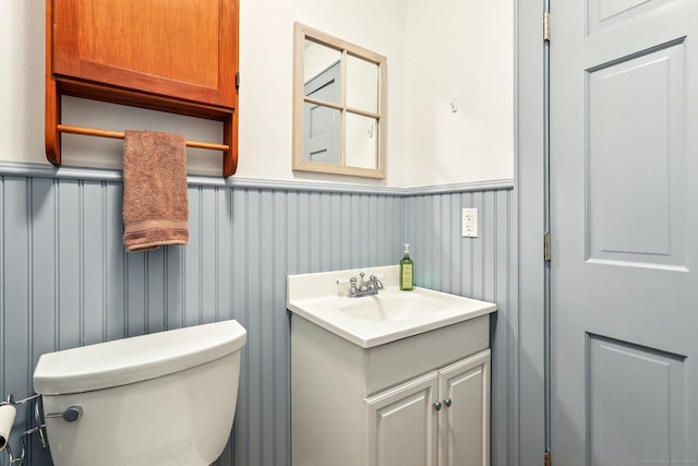 12 Lincoln Ave, Danbury, CT 06810 - bathroom featuring a wainscoted wall and vanity