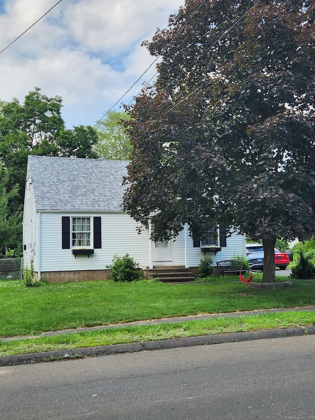 36 Pond Hill Rd, Wallingford, CT 06492 - view of property hidden behind natural elements with a front lawn and a shingled roof