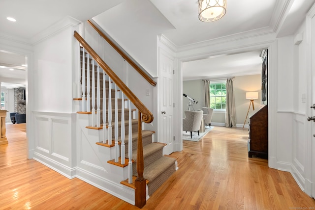 92 Hornbeam Rd, Fairfield, CT 06824 - stairs featuring wood finished floors, crown molding, and recessed lighting