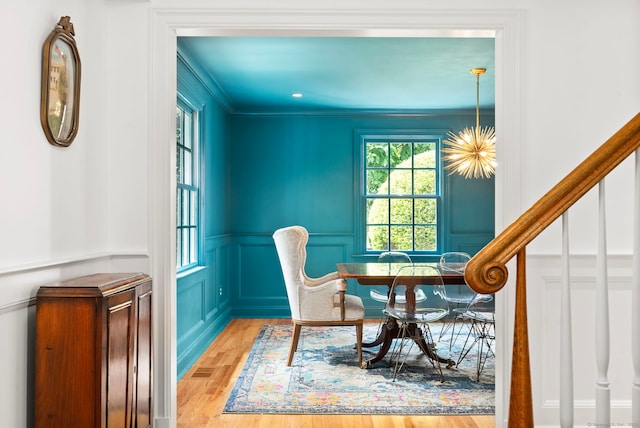 92 Hornbeam Rd, Fairfield, CT 06824 - dining room with a decorative wall, a wainscoted wall, and crown molding