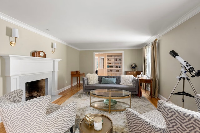92 Hornbeam Rd, Fairfield, CT 06824 - living room featuring crown molding, wood finished floors, a high end fireplace, and built in shelves