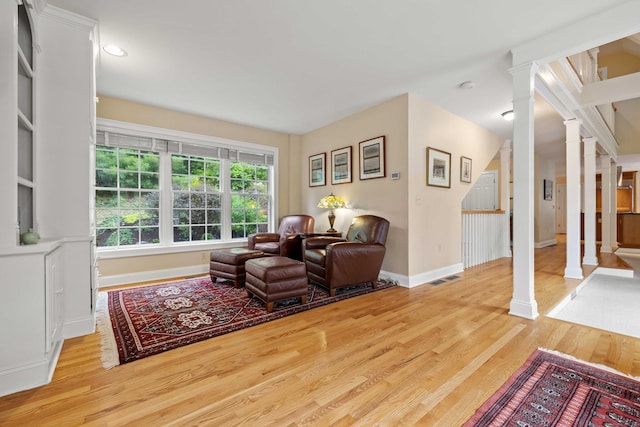 95 Cedar Swamp Rd, Chester, CT 06412 - living area featuring ornate columns, light wood finished floors, and recessed lighting