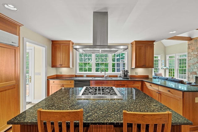95 Cedar Swamp Rd, Chester, CT 06412 - kitchen with exhaust hood, stainless steel gas cooktop, a center island, dark stone counters, and vaulted ceiling
