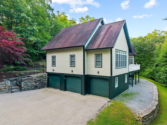 95 Cedar Swamp Rd, Chester, CT 06412 - view of home's exterior featuring an attached garage, asphalt driveway, and roof with shingles