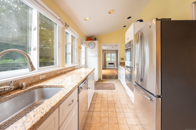 117 Long Meadow Hill Rd, Brookfield, CT 06804 - kitchen featuring appliances with stainless steel finishes, vaulted ceiling, white cabinets, recessed lighting, and light stone countertops