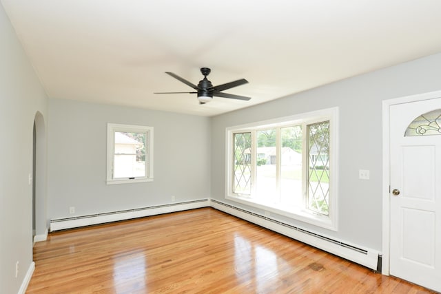 129 Tomlinson Ave, Plainville, CT 06062 - spare room featuring baseboard heating, healthy amount of natural light, and light wood-style flooring