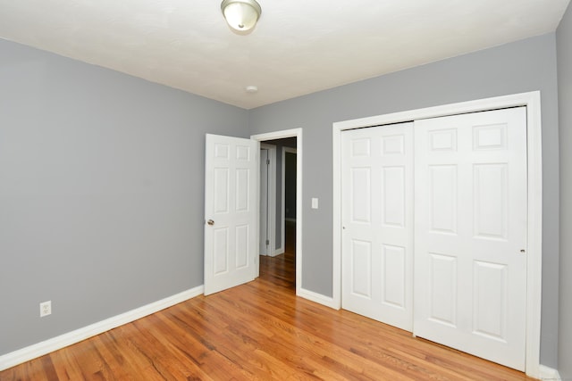 129 Tomlinson Ave, Plainville, CT 06062 - unfurnished bedroom featuring light wood finished floors and a closet