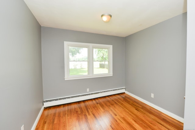 129 Tomlinson Ave, Plainville, CT 06062 - unfurnished room featuring a baseboard radiator and light wood-type flooring
