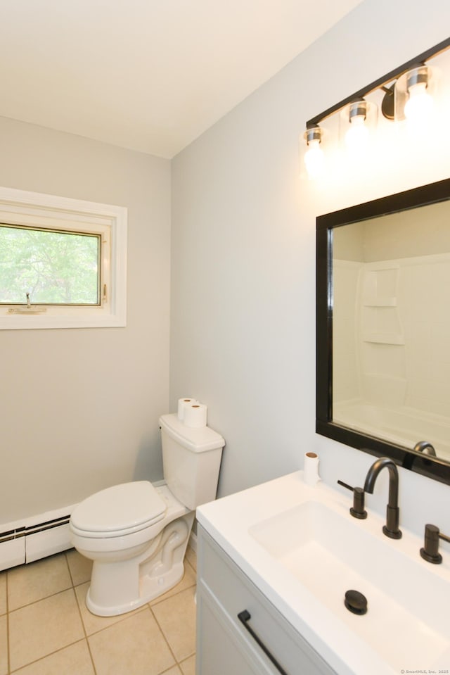 129 Tomlinson Ave, Plainville, CT 06062 - full bath with baseboard heating, vanity, and tile patterned flooring