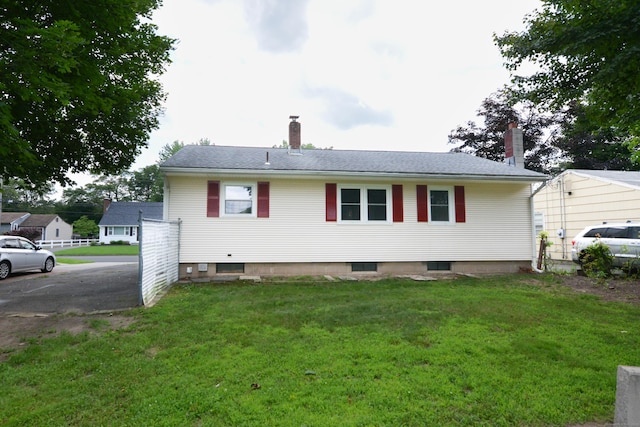 129 Tomlinson Ave, Plainville, CT 06062 - rear view of property with a chimney