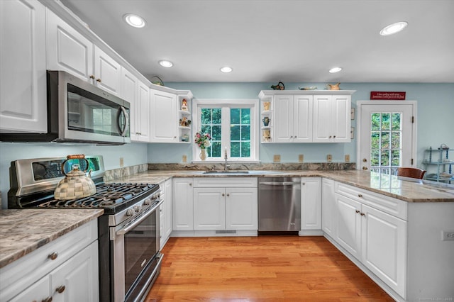 18 Overlook Ave, Middletown, CT 06457 - kitchen with appliances with stainless steel finishes, a peninsula, open shelves, white cabinetry, and recessed lighting