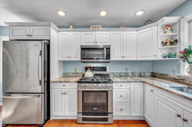 18 Overlook Ave, Middletown, CT 06457 - kitchen featuring stainless steel appliances, light wood-style flooring, and white cabinets