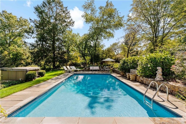 7 Calvin Rd, Wilton, CT 06897 - outdoor pool with a hot tub, a patio area, and view of scattered trees
