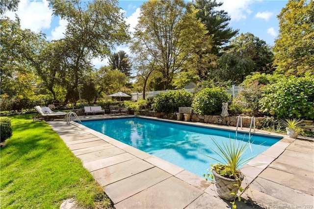 7 Calvin Rd, Wilton, CT 06897 - view of swimming pool featuring a patio, a fenced backyard, and view of wooded area