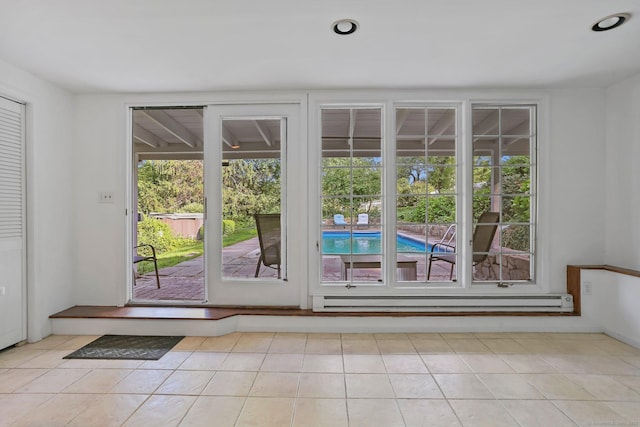 7 Calvin Rd, Wilton, CT 06897 - doorway with baseboard heating and light tile patterned floors