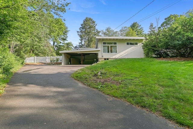 7 Calvin Rd, Wilton, CT 06897 - mid-century modern home with asphalt driveway and a carport