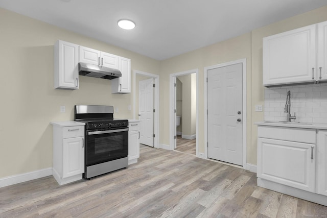 85 Twiss St, Meriden, CT 06450 - kitchen with stainless steel range with gas stovetop, under cabinet range hood, light countertops, and white cabinets