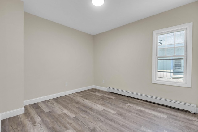 85 Twiss St, Meriden, CT 06450 - spare room featuring a baseboard radiator and wood finished floors