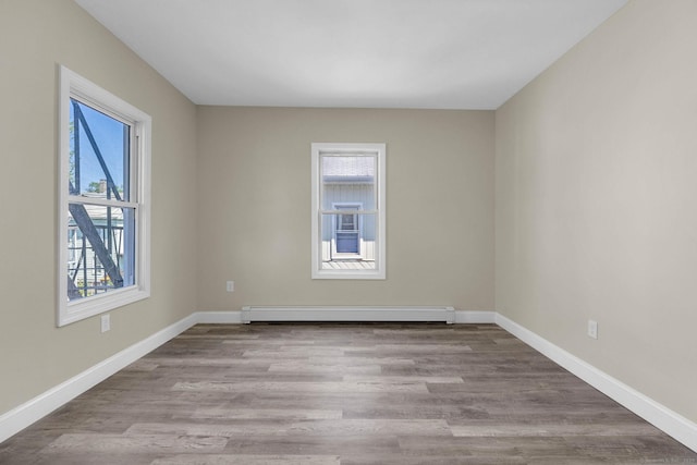 85 Twiss St, Meriden, CT 06450 - empty room featuring a baseboard radiator and wood finished floors