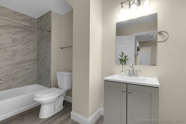85 Twiss St, Meriden, CT 06450 - bathroom with vanity, wood finished floors, and  shower combination