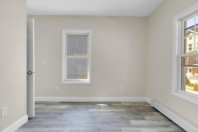 85 Twiss St, Meriden, CT 06450 - empty room with baseboard heating and wood finished floors
