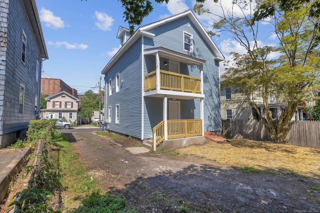 85 Twiss St, Meriden, CT 06450 - rear view of property featuring a balcony and asphalt driveway