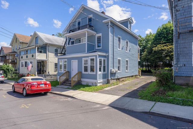 85 Twiss St, Meriden, CT 06450 - view of front of home with a balcony and uncovered parking