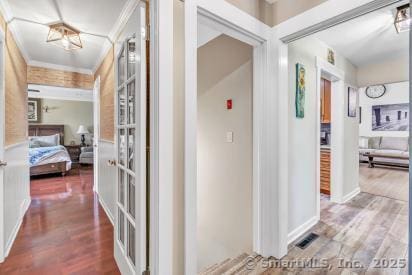 92 Seminole Ln Unit B, Stratford, CT 06614 - hallway with wood finished floors and ornamental molding