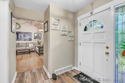 92 Seminole Ln Unit B, Stratford, CT 06614 - entryway featuring wood finished floors and baseboards