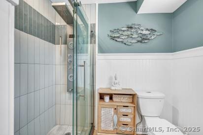 92 Seminole Ln Unit B, Stratford, CT 06614 - bathroom with a stall shower and a wainscoted wall