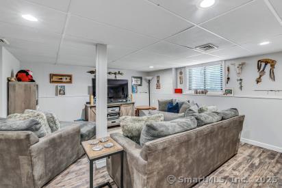 92 Seminole Ln Unit B, Stratford, CT 06614 - living room with wood finished floors, recessed lighting, and a drop ceiling