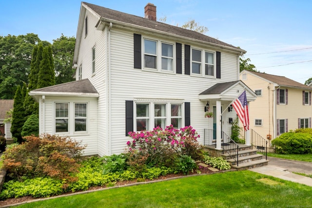 14 Maple St, Darien, CT 06820 - view of front facade featuring a chimney, a front yard, and a shingled roof