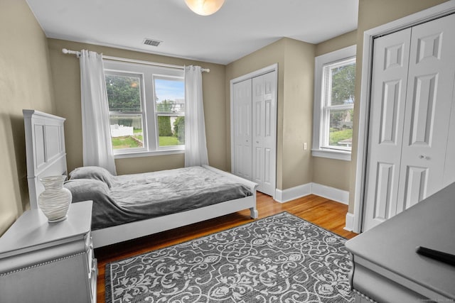 14 Maple St, Darien, CT 06820 - bedroom with multiple closets and wood finished floors