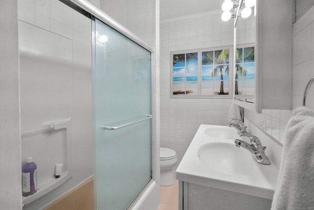 14 Maple St, Darien, CT 06820 - full bathroom with combined bath / shower with glass door, double vanity, and tile walls