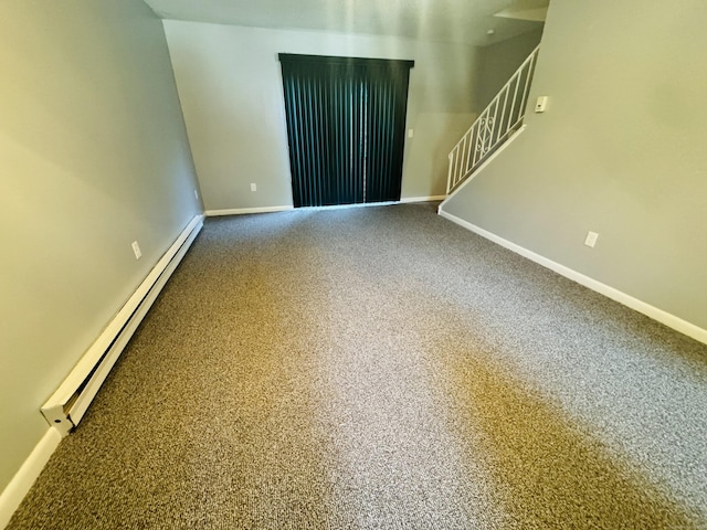 44 Athol St Unit 44, Killingly, CT 06239 - spare room featuring a baseboard heating unit, stairs, and carpet flooring