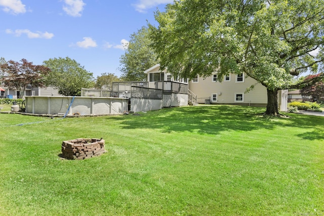 66 Pinnacle Rd, Bristol, CT 06010 - view of grassy yard with a fire pit, a deck, an outdoor pool, and stairs